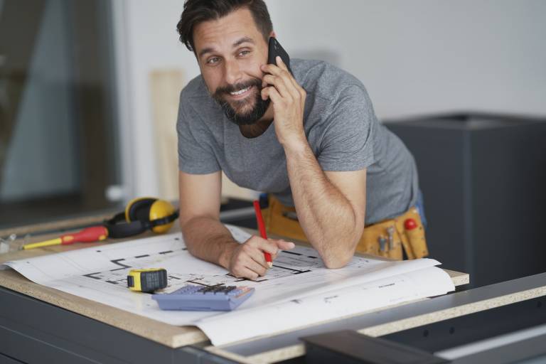 Home builder contractor on the phone