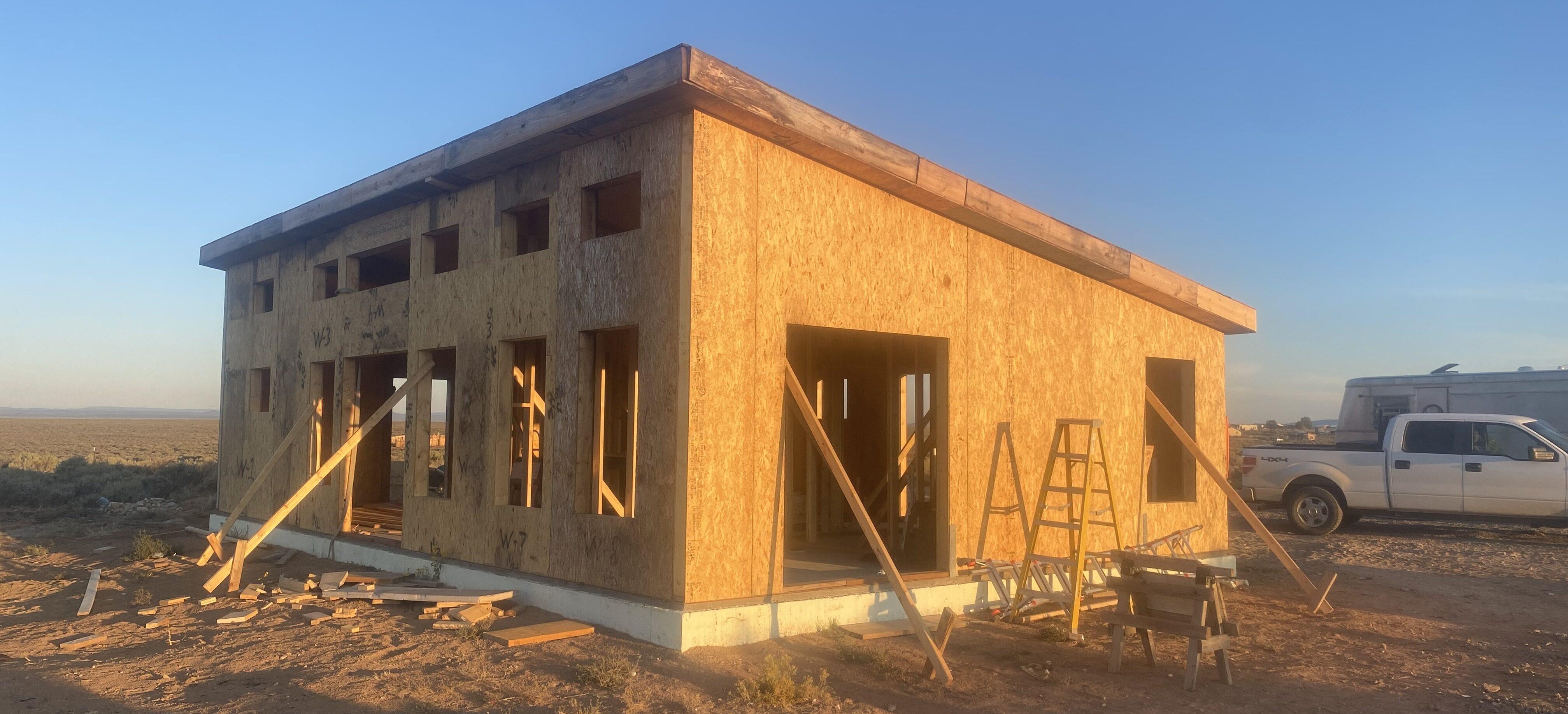 construction of  mighty small homes modern model in the New Mexico high desert town of El Prado